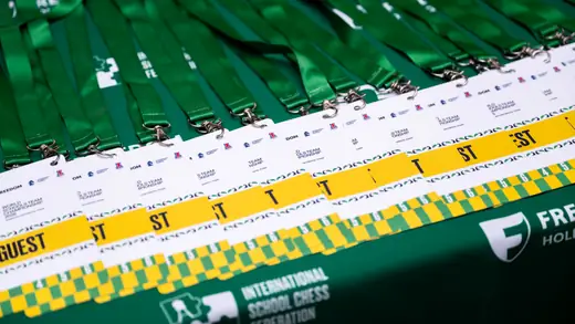 Row of conference lanyards and accreditation badges