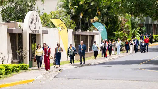 Participants walking along the road towards the Cariari Country Club