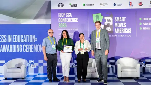 One of the awarded schools receiving its certificate