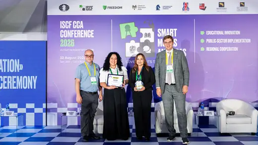 One of the awarded schools receiving its certificate