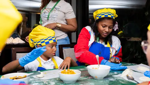 Young players making empanadas during the cooking master class