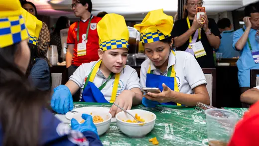 Young players making empanadas during the cooking master class