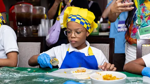 Young players making empanadas during the cooking master class