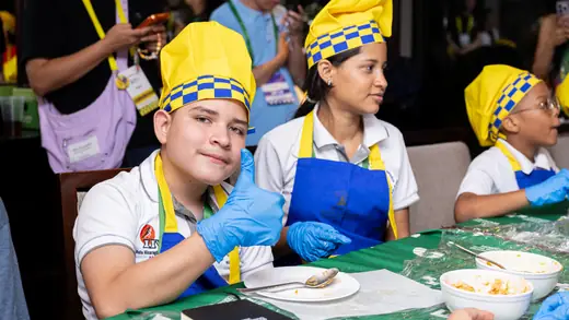 Young players making empanadas during the cooking master class