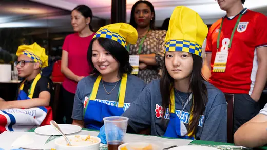 Young players making empanadas during the cooking master class