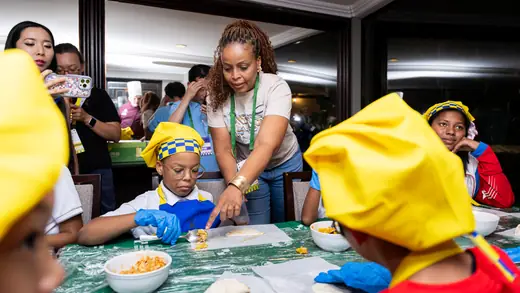 Young players making empanadas during the cooking master class