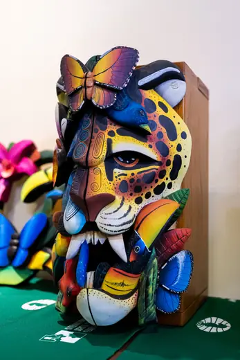A finished mask, painted and signed