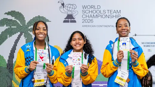 Three players holding up the cards they made